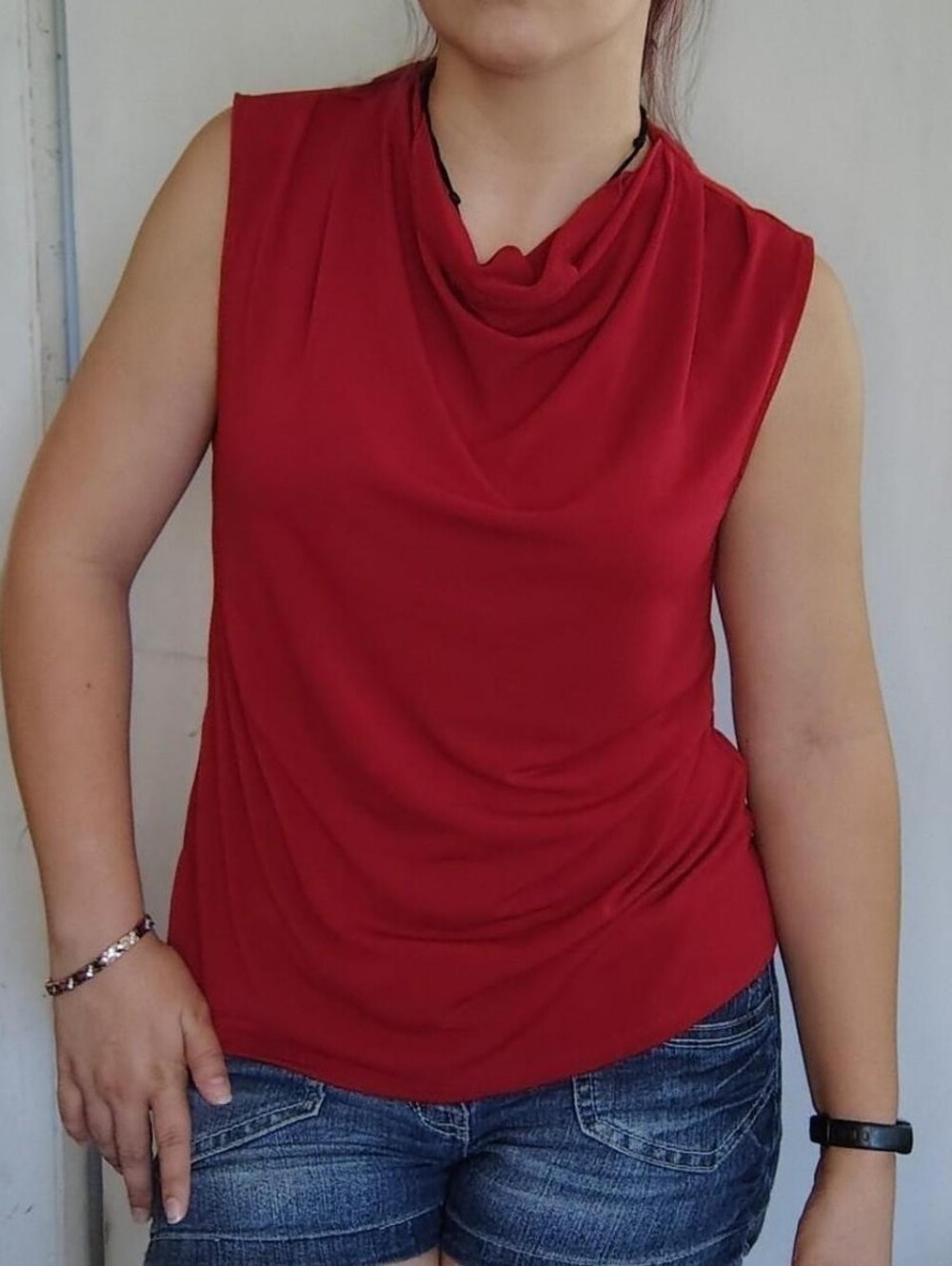 red 90s chic sleeveless blouse with a ruched neckline